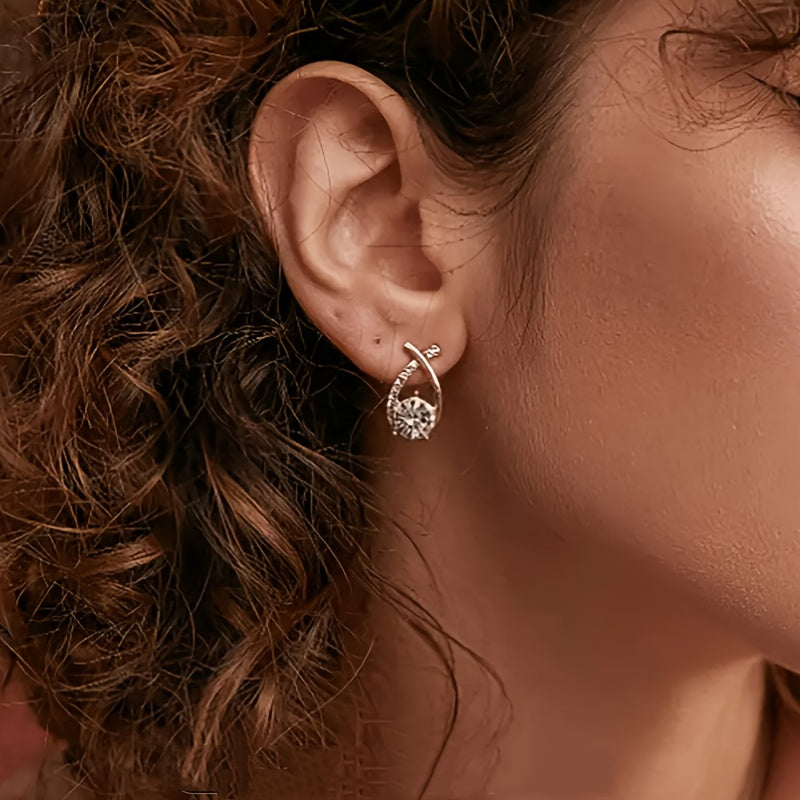 Boucles d'oreilles pendantes avec croix dorée et zirconia