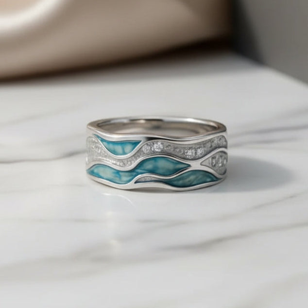 Regina - Bague en argent avec d’élégantes vagues turquoise