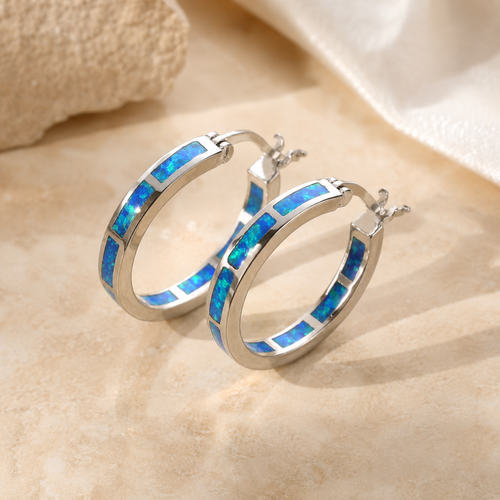 Belén - Élégantes boucles d’oreilles circulaires en opale de feu bleue