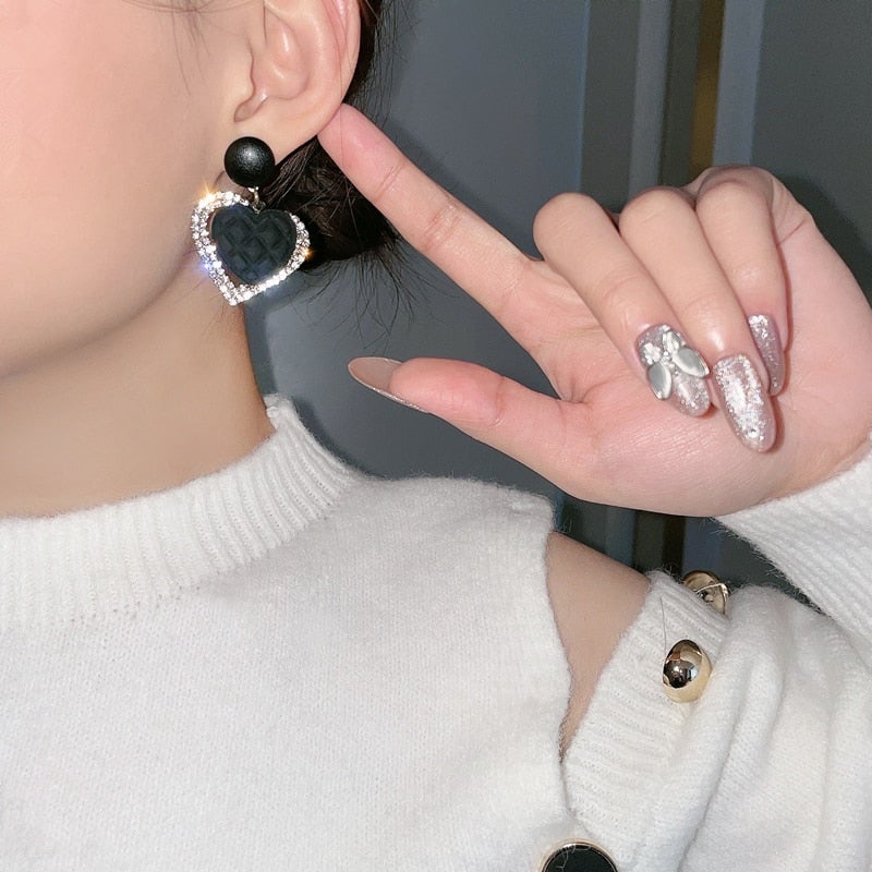 Boucles d'oreilles en forme de cœur en or noir