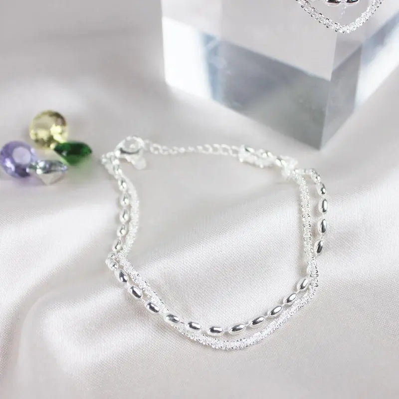 Amparo - Élégant ensemble de bracelets argentés avec des pierres en zircone cubique