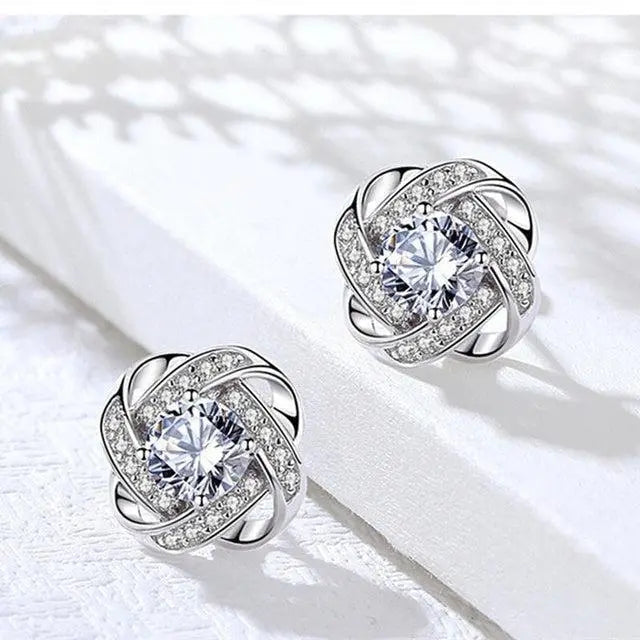 Lourdes - Boucles d’oreilles dorées en spirale avec cristaux étincelants