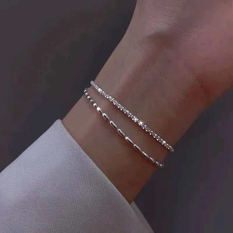 Amparo - Élégant ensemble de bracelets argentés avec des pierres en zircone cubique