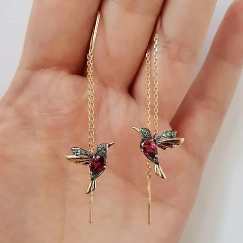 Amalia - Élégantes boucles d’oreilles en fil avec colibri doré et cristaux scintillants